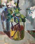 Close up of a framed vintage oil painting of white apple blossom flowers.