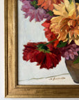 Framed, vintage, still life oil painting of a bouquet of red flowers.