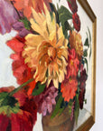 Framed, vintage, still life oil painting of a bouquet of red flowers.