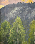 Framed, vintage, oil painting of a landscape with trees and mountains.