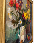 Close up of a framed impressionist oil painting on board of a bouquet of flowers with fruit. Still life art.