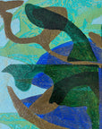 Close up of a framed, green & blue mixed media artwork with abstract design.