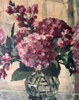 Close up of a vintage oil painting on canvas of a bouquet of dark pink hydrangeas in a glass vase.
