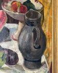 Close up of a framed still life oil vintage painting with watermelon, fruit, and jug on a table.