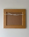 Reverse of a framed vintage painting oil on board