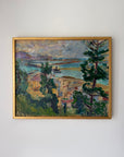 A framed vintage landscape painting depicting a coastal village with trees, water, and buildings rendered in textured brushstrokes of green, blue, yellow, and purple tones, enclosed in a gold frame. Available at Hue.