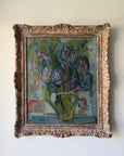 A vintage oil painting of a floral bouquet in a green pitcher, housed in an ornate, carved antique-style gold frame. Available at Hue.