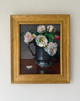 A framed vintage still life oil painting of white and pink roses in a dark blue jug. Professionally re-framed. Available at Hue.