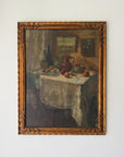 Framed vintage oil painting of a still life scene on a table. Available at Hue.