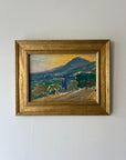 Framed vintage oil painting of a landscape with mountains and trees. Available at Hue.