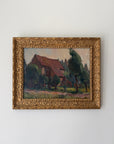 Framed vintage oil painting of a rural farmhouse in an ornate gilt frame. Available at Hue.