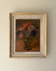 Framed vintage oil painting of flowers in a vase. Avaulable at Hue.