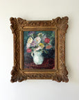 Framed vintage oil painting of a bouquet flowers in a white jug with an ornate gilt vintage frame, available at Hue
