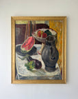 Framed still life oil vintage painting with watermelon, fruit, and pitcher on a table, available at Hue.