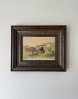 Framed vintage oil painting of cows in a field. Available at Hue.
