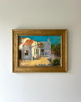 A framed vintage oil painting of a rural spanish villa in the sunshine. Available at Hue.