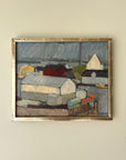 Framed vintage oil painting of a coastal scene with buildings and water in a vintage silver gilt frame, available at Hue.