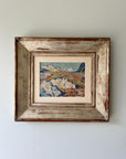 A framed vintage oil painting of a mountainous landscape in a vintage frame, available at Hue.