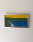 Framed vinatge abstract painting with a yellow background and blue water. Available at Hue.