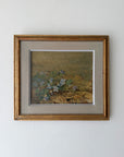 Framed vintage oil painting of blue flowers in a landscape. Available at Hue.