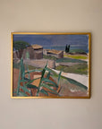 Framed vintage oil painting of a coastal landscape with huts. Available at Hue.