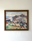 Large framed vintage oil painting of a landscape with blossom and a distant hillside town. Available at Hue.