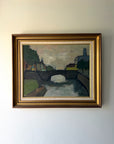 Framed vintage oil painting of a landscape with a bridge over a canal. Available at Hue.