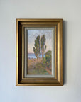 Framed vintage oil painting of a landscape with trees and water. Available at Hue.