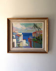 Framed vintage oil painting of a coastal scene with buildings and palm trees. Available at Hue.