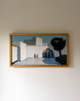 Framed vintage oil painting of a landscape with whitewashed buildings and people. Available at Hue.