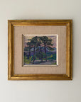 Framed vintage oil painting of pine trees. Available at Hue.