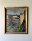 Framed vintage oil painting of an urban scene with buildings and a street. Available at Hue.