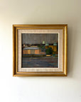 Framed vintage acrylic painting of a cityscape with riverside buildings. Available at Hue.