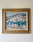 Framed vintage oil painting of a village scene with trees in a vintage gilt frame, available at Hue.