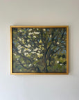 A framed vintage oil painting of blossom tree branches. Available at Hue.