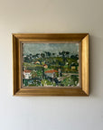 Framed vintage oil painting of a landscape with greenery and a village. Available at Hue.