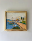 Framed vintage oil painting of a coastal scene with boats and a dock, available at Hue.