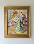 Framed vintage oil painting of a vase with colorful flowers in a gilt frame, available at Hue.