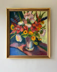 Framed vintage oil painting of a colorful bouquet of flowers. Available at Hue.
