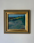 Framed vintage oil painting of a landscape with a gold frame. Available at Hue.