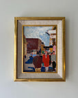 A vivid framed vintage oil painting of a busy street scene with figures and buildings, available at hue.