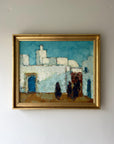 Framed vintage oil painting of a cityscape with whitewashed buildings, available at Hue