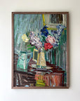 Framed painting of a still life with book, jugs, roses and stocks