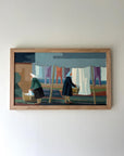 Framed artwork of two figures by a washing line in oak frame, available from hue