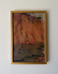 A framed vintge landscape oil painting featuring textured brushstrokes of warm orange, brown, and muted green tones, housed in a gold-toned frame. Available at Hue.