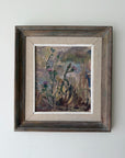 A framed vintage landscape oil painting featuring wildflowers, presented in a rustic dark brown wooden frame with a beige linen mat. Available at Hue.