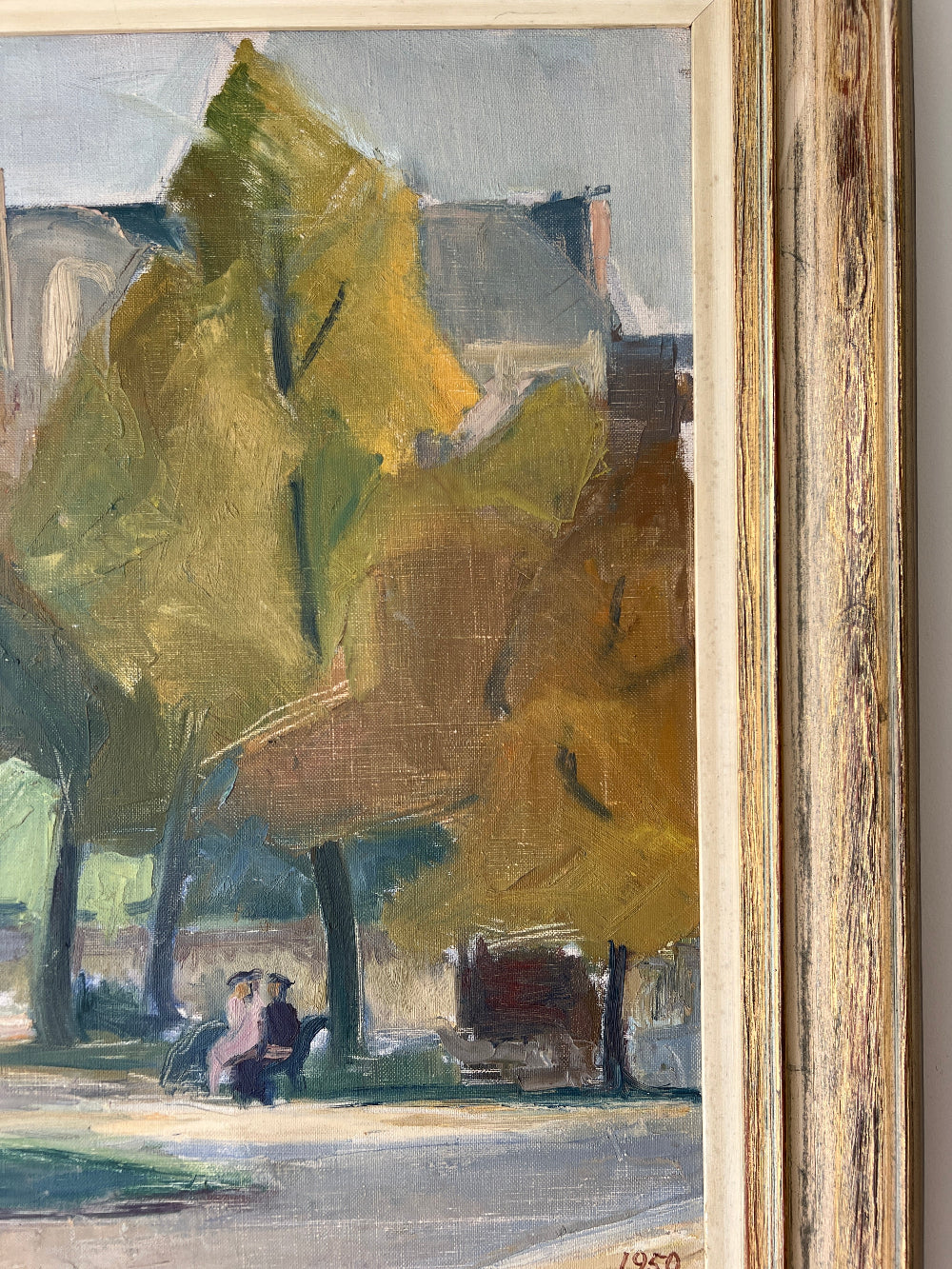 Framed, vintage oil painting of a park scene with trees and people 