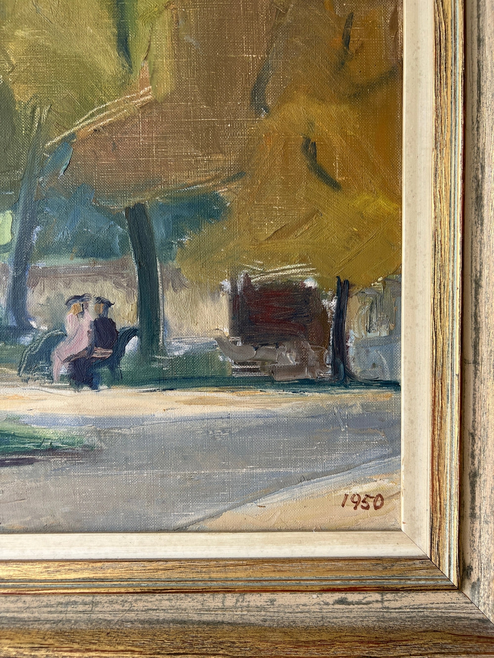 Framed, vintage oil painting of a park scene with trees and people 