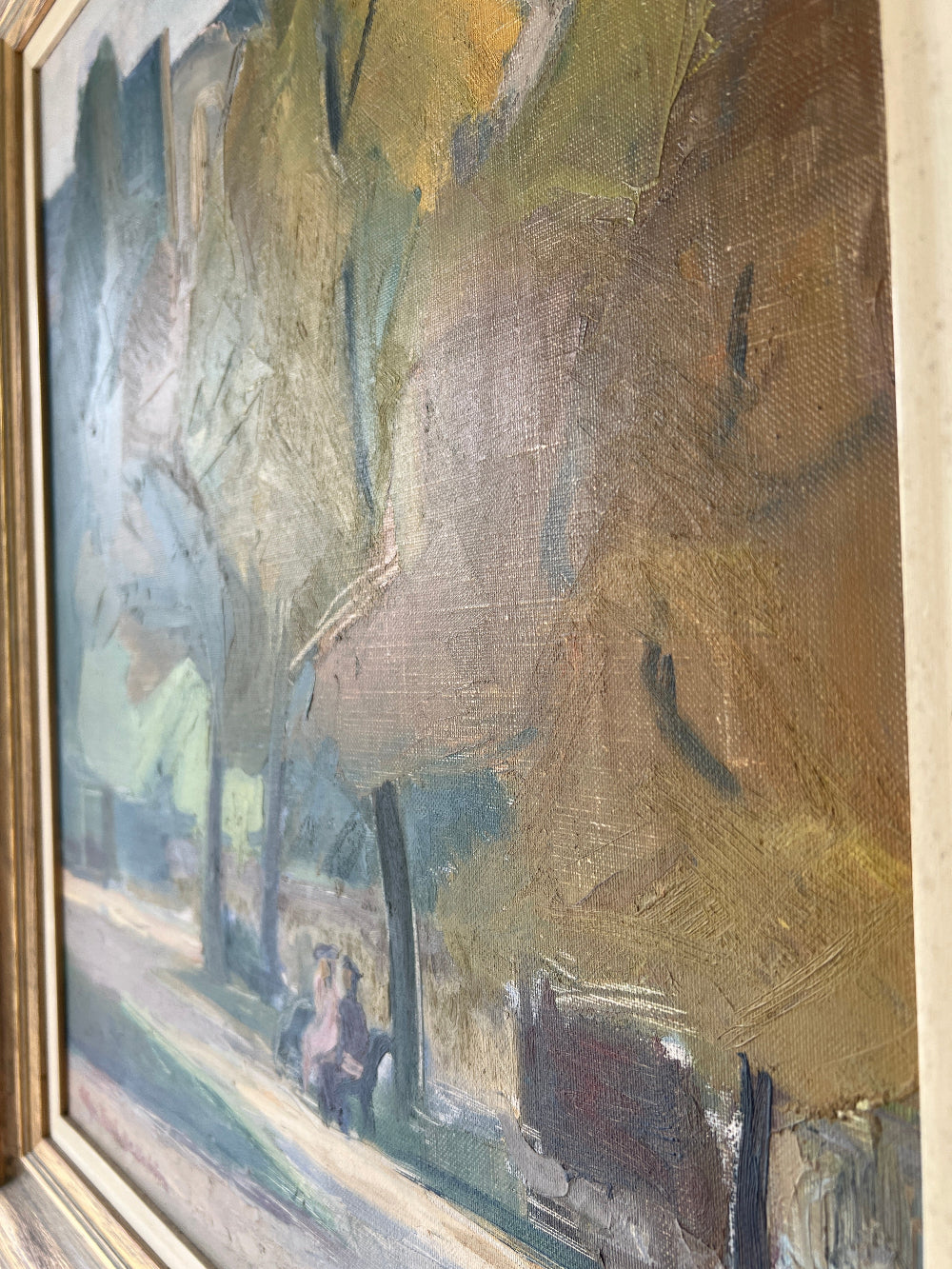 Framed, vintage oil painting of a park scene with trees and people 