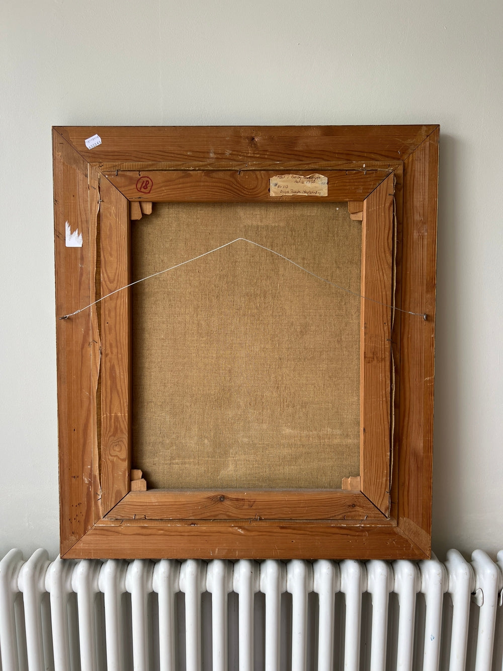 Back view of a vintage wooden picture frame, oil on canvas